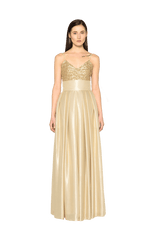 Bodenlanger Faltenrock mit glockigem Fall und sehr breitem Bund in der Taille bestehend aus feiner goldener Seide und passendem Paillettentop in Gold